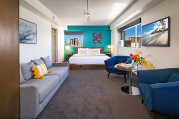 Premium bedding, down comforters, in-room safe, desk at Vive Hotel Waikiki