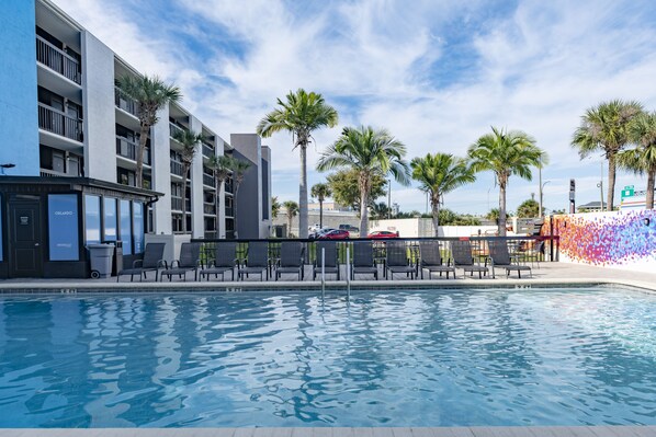 Outdoor pool, pool umbrellas, sun loungers