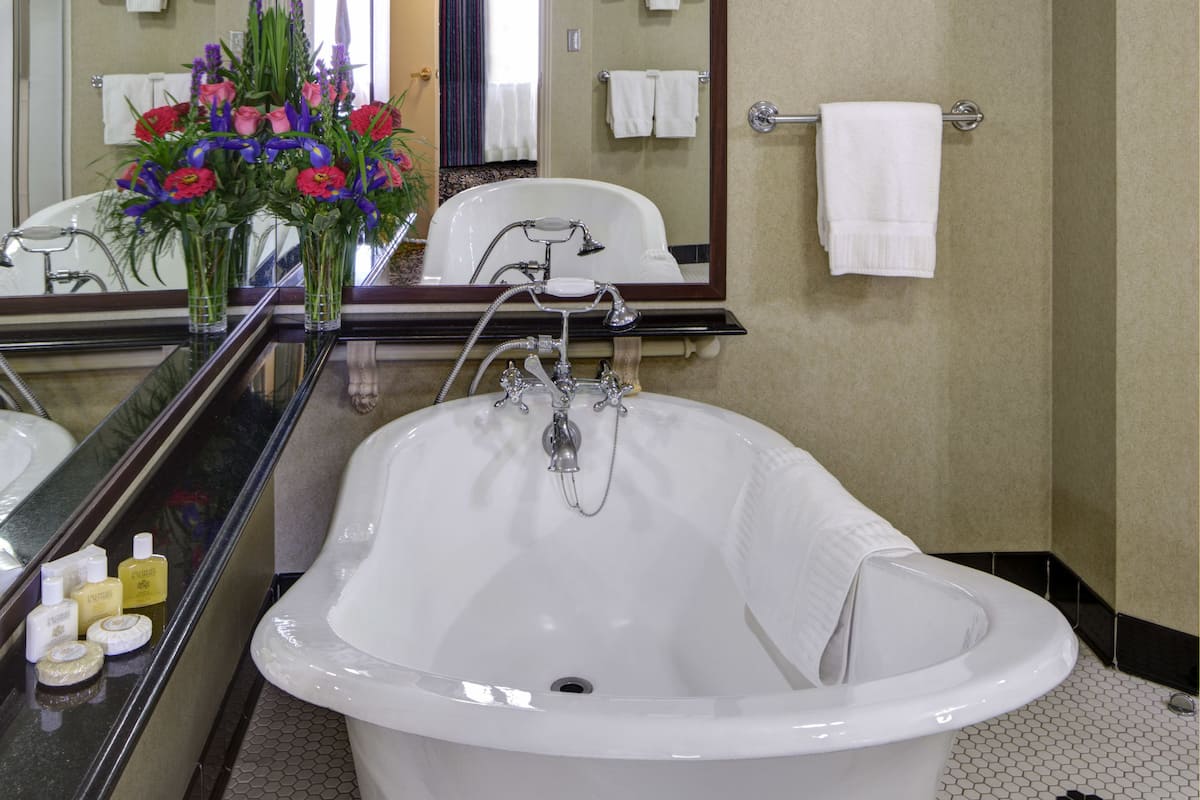 presidential suite, 1 king bed | bathroom | separate bathtub and shower, free toiletries, hair dryer, towels