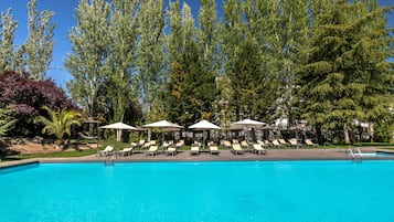 Seasonal outdoor pool, open 10:30 AM to 9:00 PM, pool umbrellas