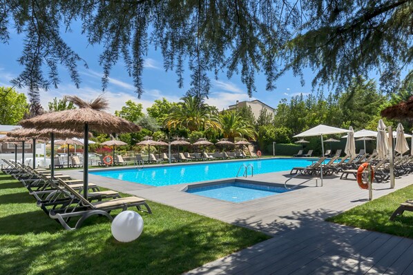 Seasonal outdoor pool, open 10:30 AM to 9:00 PM, pool umbrellas