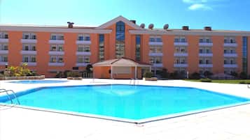 Relax by the pool surrounded by a spacious deck and enjoy the views of the surrounding building.