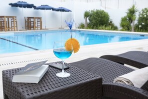 Outdoor pool, open 10:00 AM to 6:00 PM, sun loungers