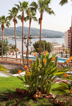 Outdoor pool, open 10 AM to 6 PM, pool umbrellas, pool loungers
