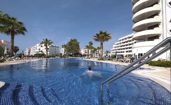 Indoor pool, outdoor pool, pool umbrellas