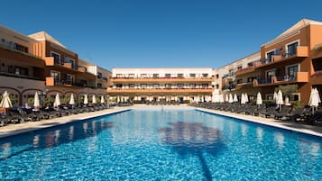 Indoor pool, outdoor pool, pool umbrellas, pool loungers