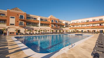 Indoor pool, outdoor pool, pool umbrellas, pool loungers