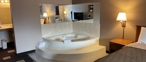1 King Bed, Jacuzzi Suite, NO PETS, Non-Smoking | Desk, laptop workspace, soundproofing, iron/ironing board