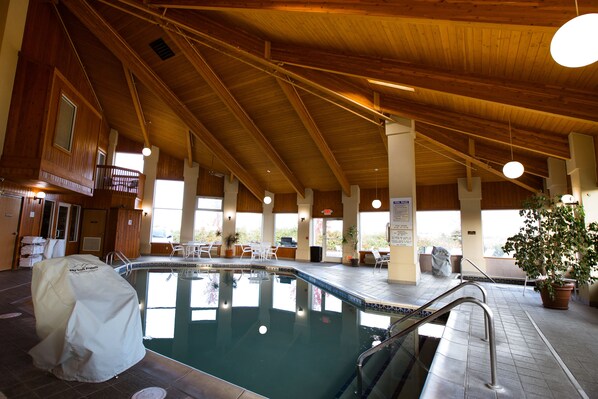 Indoor pool, open 8:00 AM to 10:00 PM, pool loungers