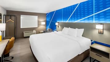 Premium bedding, desk, laptop workspace, blackout curtains