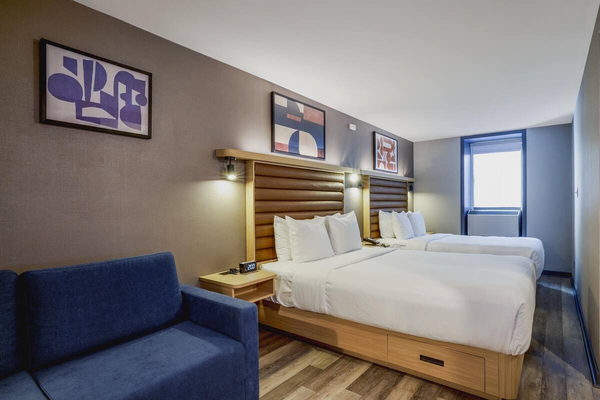 Family Suite, 2 Queen Beds, Non Smoking (with Sofabed) | Blackout curtains, iron/ironing board, free cots/infant beds, free WiFi