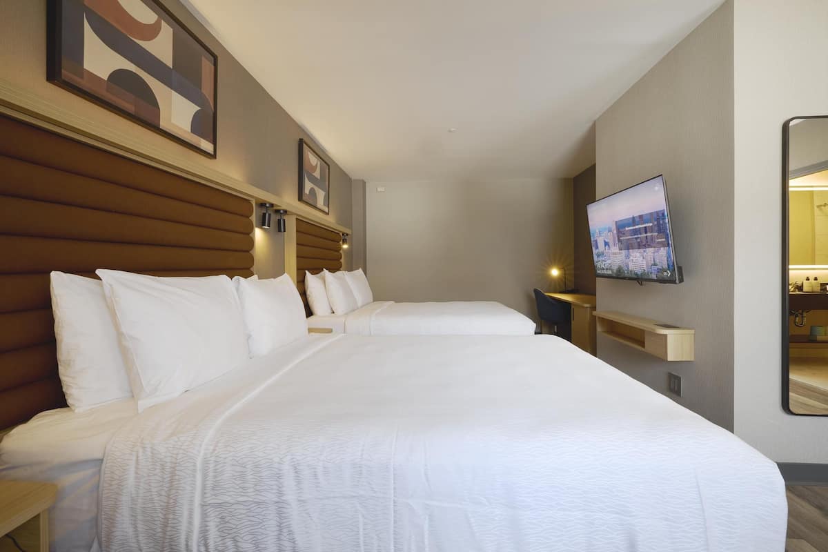 Deluxe Room, 2 Queen Beds, Non Smoking | Blackout curtains, iron/ironing board, free cots/infant beds, free WiFi