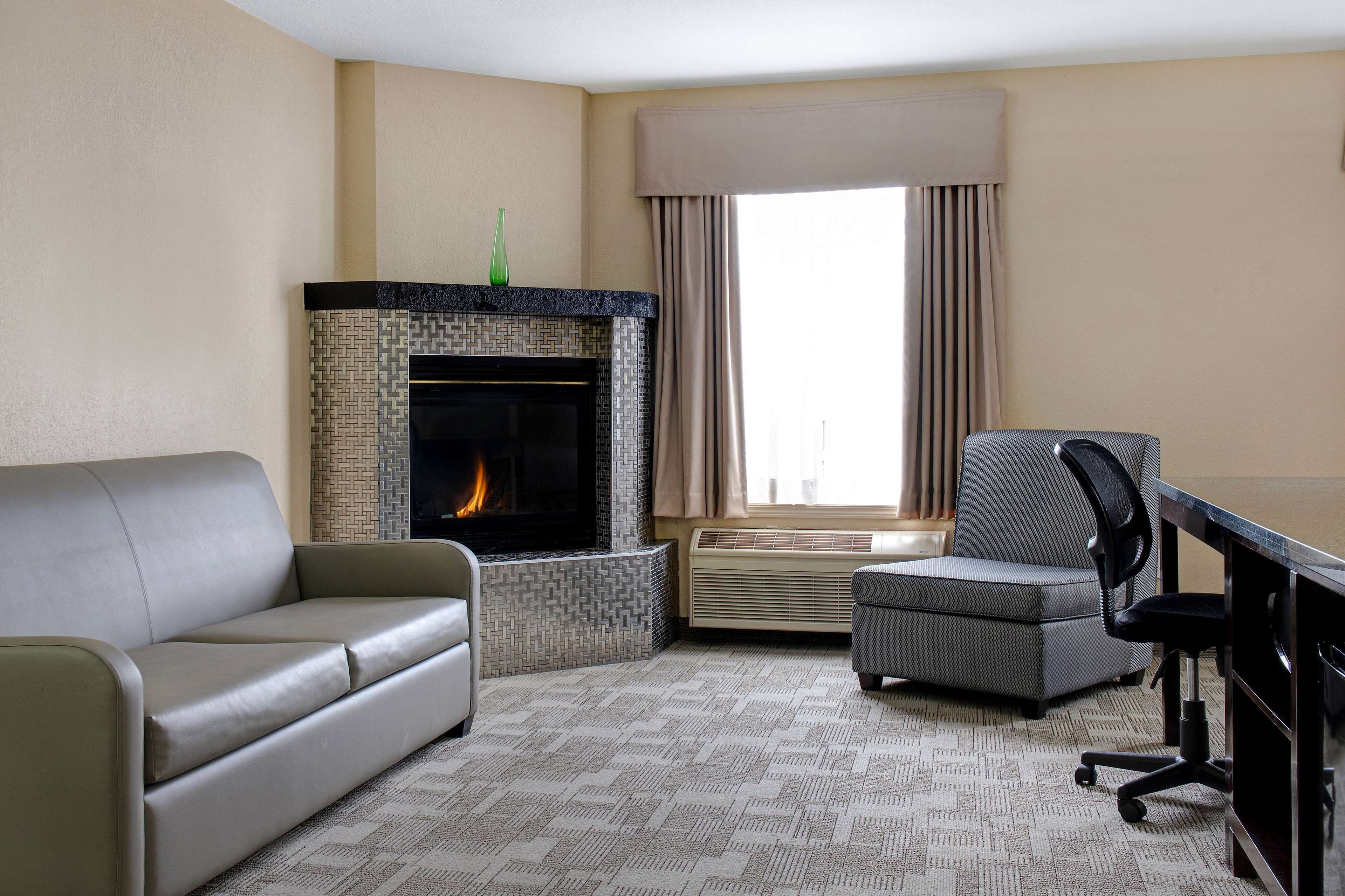 1 king suite fireplace and sofa bed | premium bedding, desk, blackout curtains, iron/ironing board