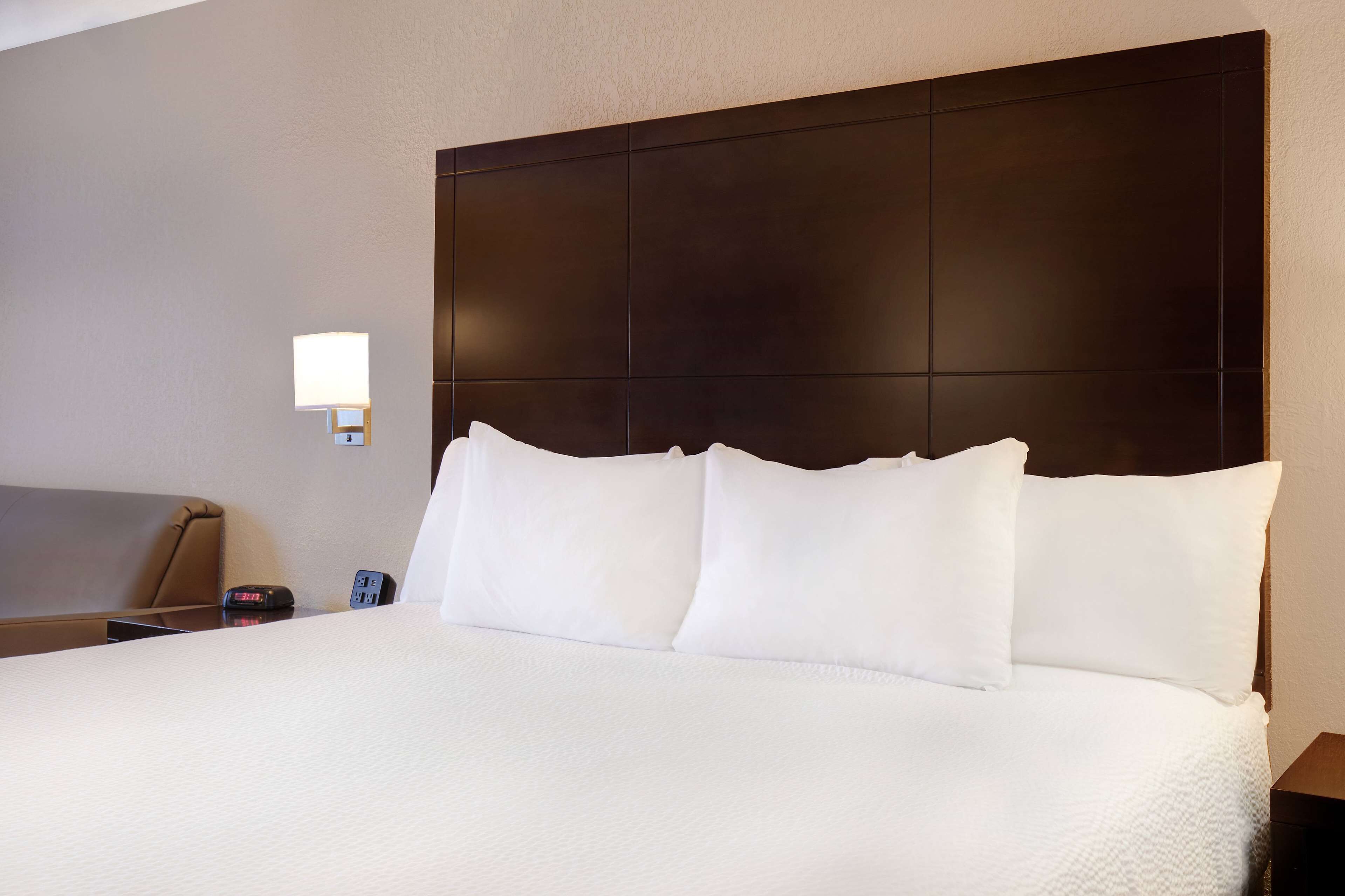 classic 1 king bed room with sofa bed | premium bedding, desk, blackout curtains, iron/ironing board