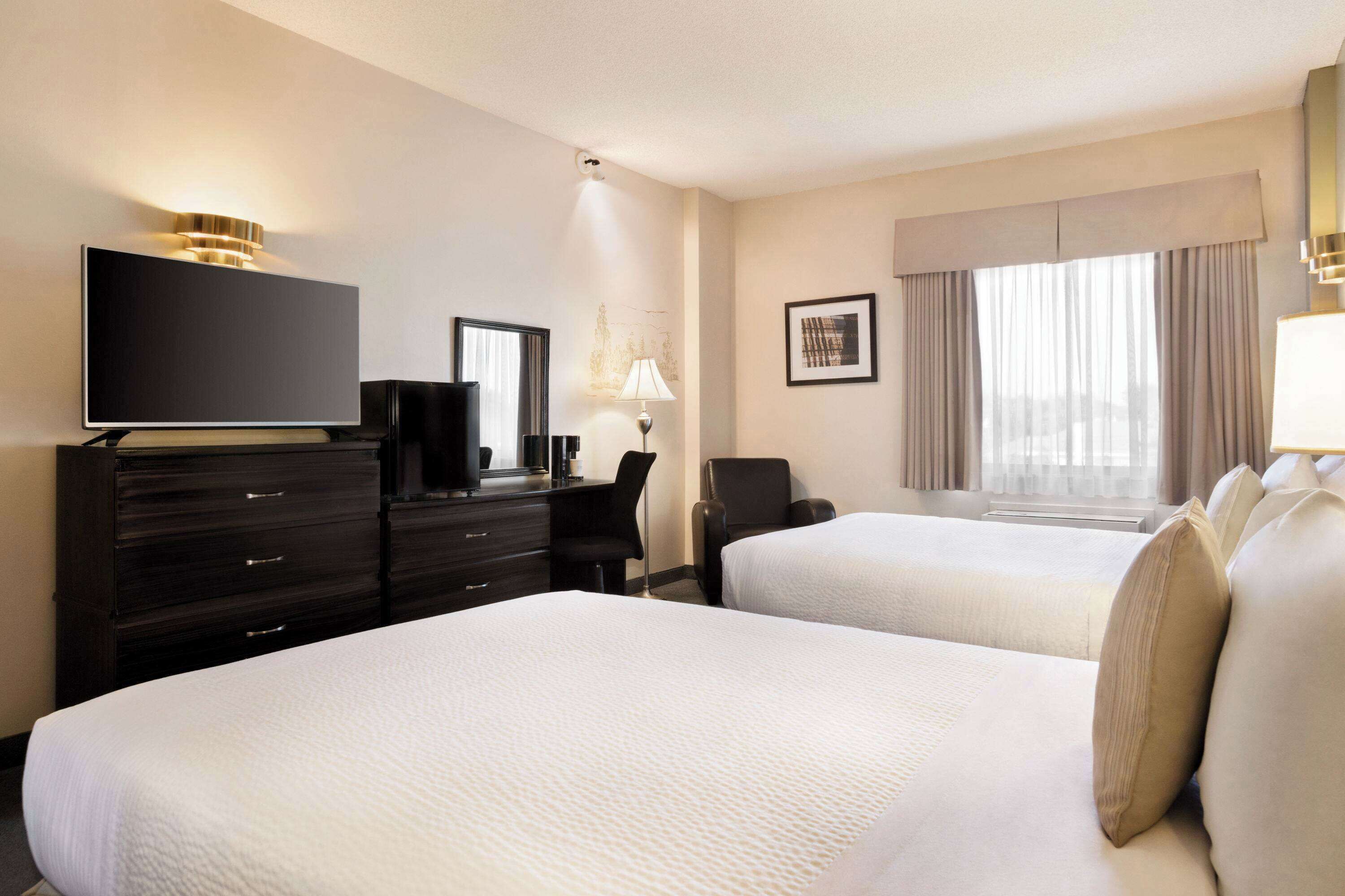 Desk, blackout drapes, iron/ironing board, bed sheets
