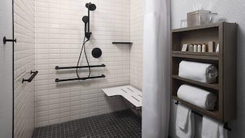 A modern bathroom with a shower, a toilet, a sink, and a shelf with towels and toiletries.