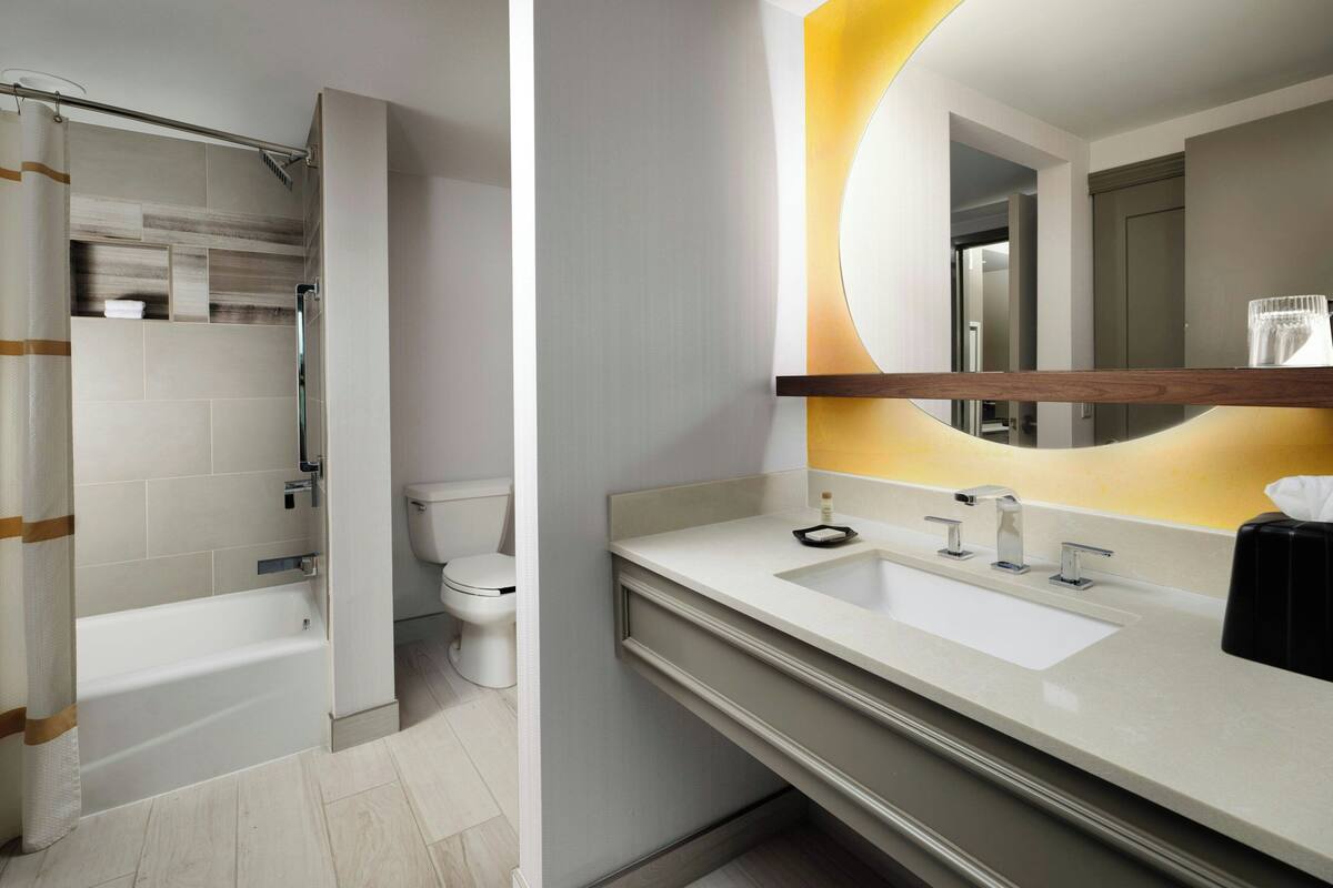 combined shower/bathtub, designer toiletries, hair dryer, bathrobes