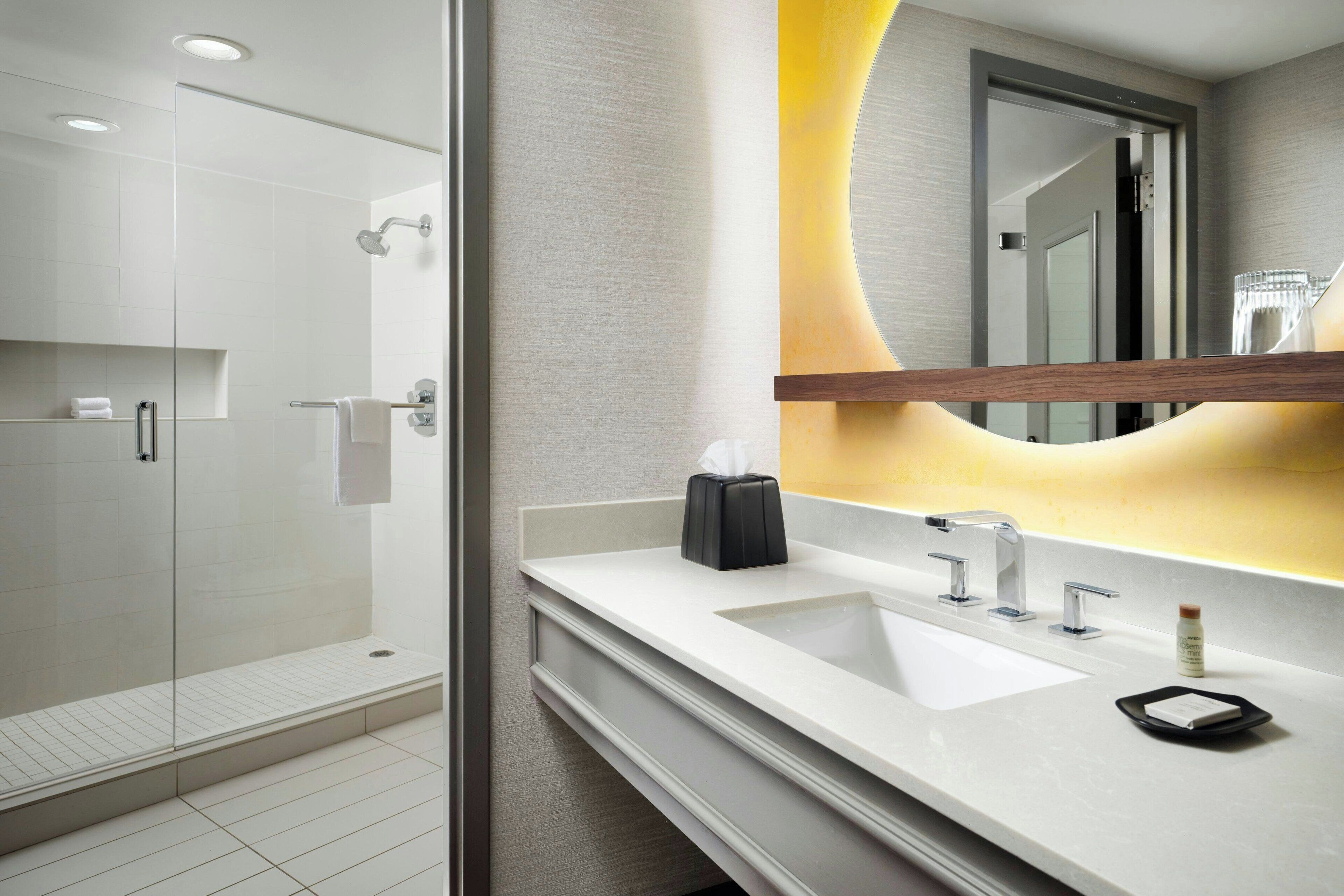 combined shower/bathtub, designer toiletries, hair dryer, bathrobes