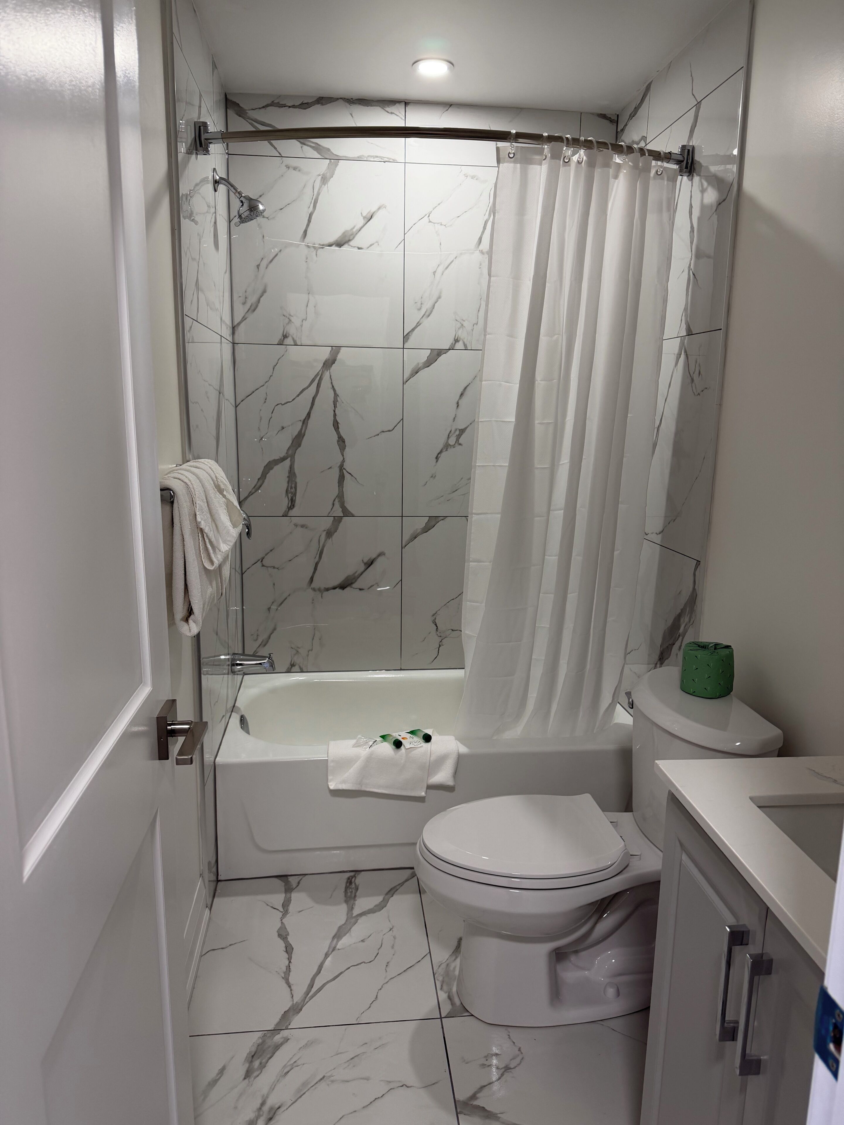 Room, 2 Double Beds | Bathroom | Combined shower/tub, free toiletries, hair dryer, towels