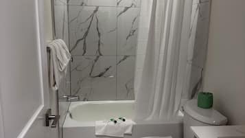 Room, 2 Double Beds | Bathroom | Combined shower/tub, free toiletries, hair dryer, towels