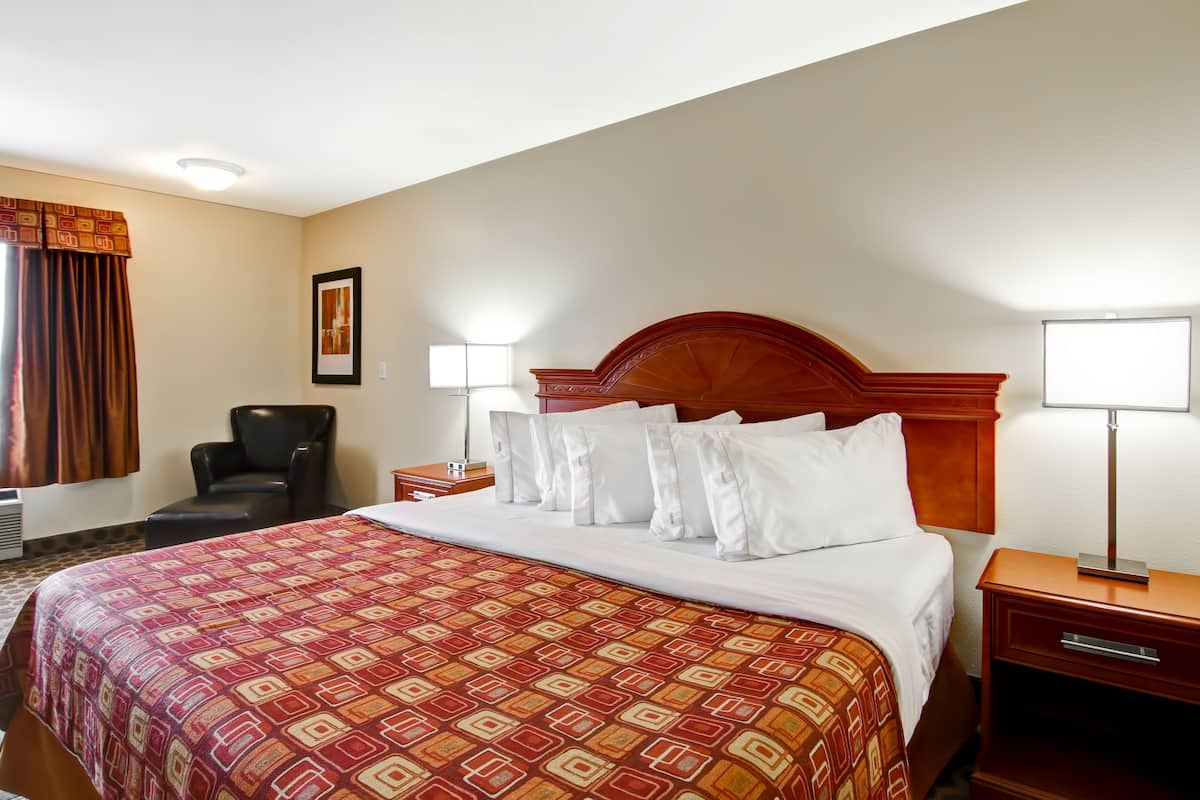 premium bedding, pillow-top beds, desk, laptop workspace