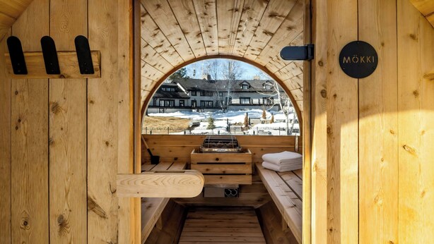 A wooden sauna with benches and a view of a snowy landscape. - Mont Gabriel, Sainte-Adele, a Tribute Portfolio Resort (Sainte-Adele)