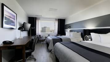 Premium bedding, desk, laptop workspace, blackout curtains