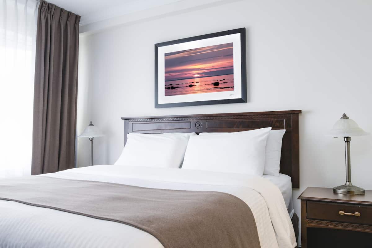 premium bedding, desk, laptop workspace, blackout curtains