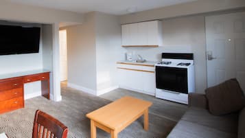 Family Suite | Living area | 48-inch LED TV with cable channels
