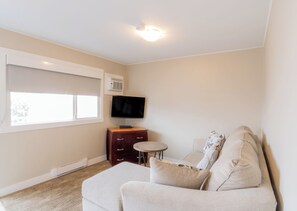 Suite, 1 Queen Bed, Kitchen | Living area | 48-inch LED TV with cable channels - Scott's Inn and Suites (Kamloops)