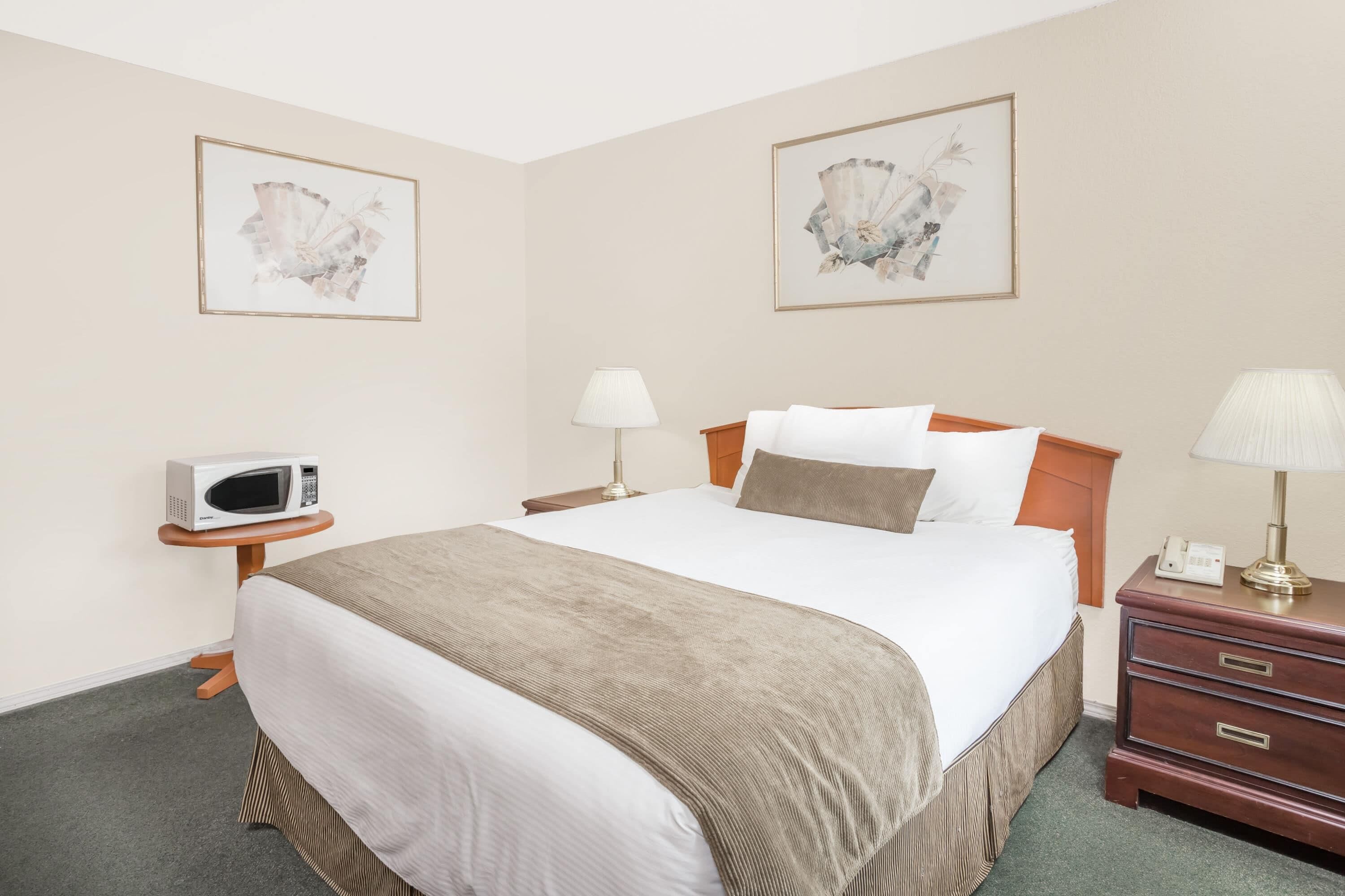 Premium bedding, desk, laptop workspace, blackout curtains