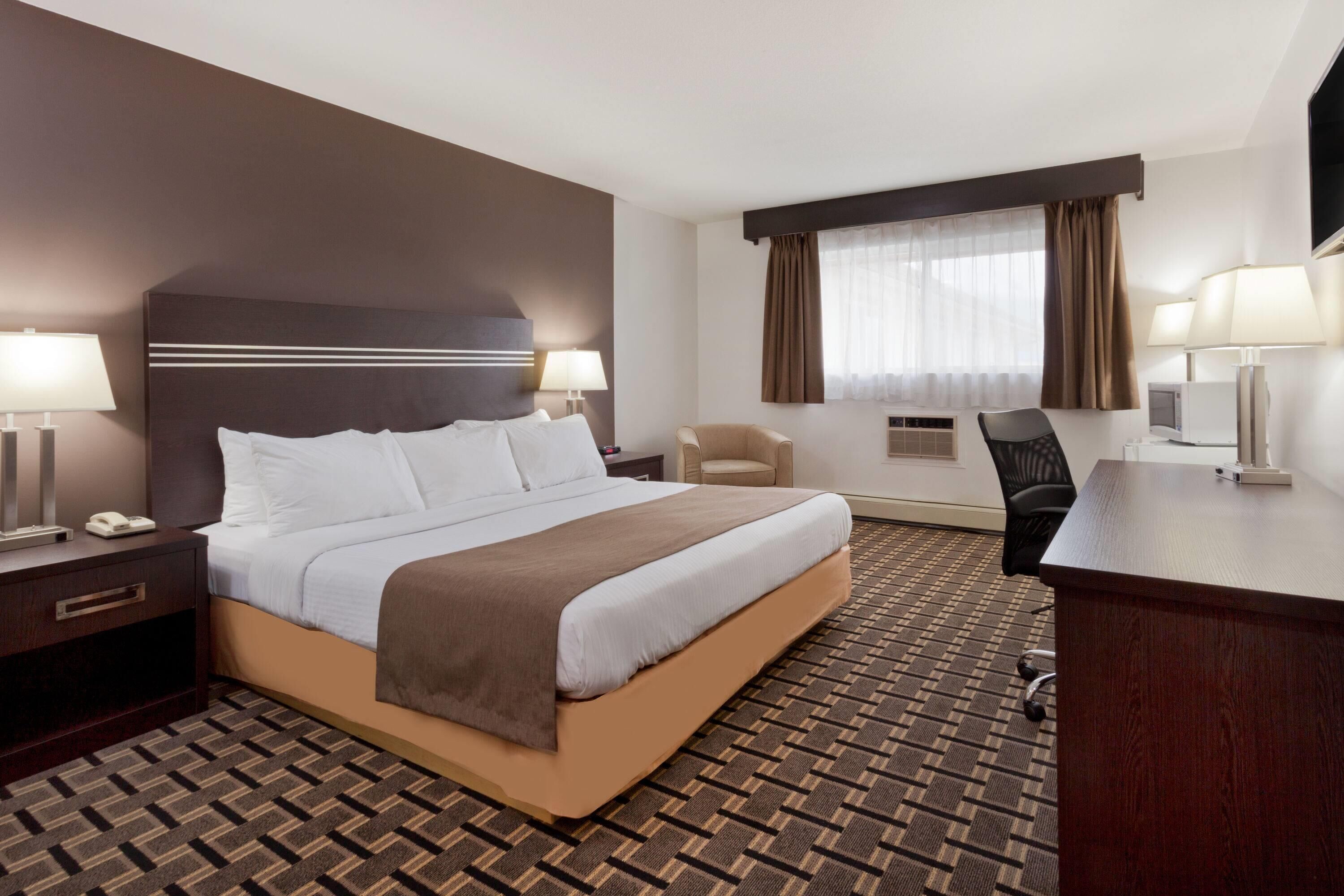 Hypo-allergenic bedding, desk, blackout drapes, iron/ironing board