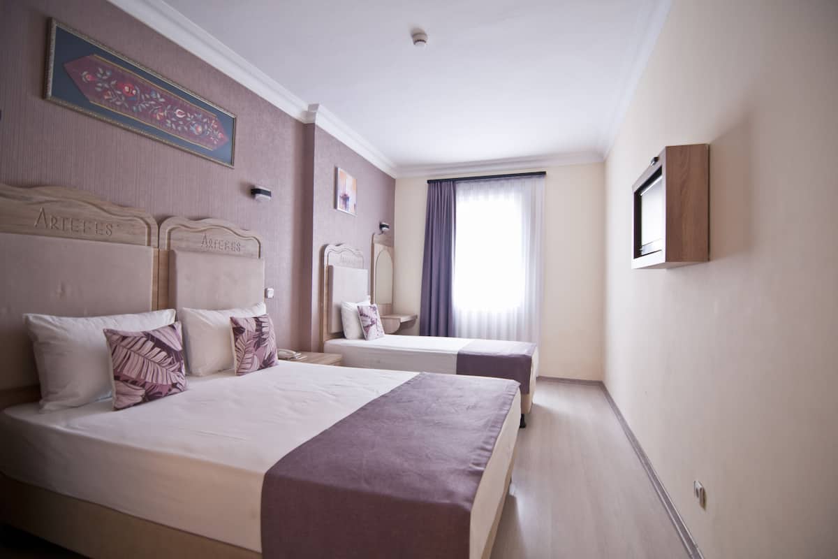 Economy Triple Room | 1 bedroom, Egyptian cotton sheets, premium bedding, in-room safe