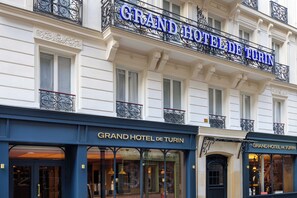 The exterior of the Grand Hotel de Turin with its classic architecture and signage. - Grand Hotel De Turin (Paris)