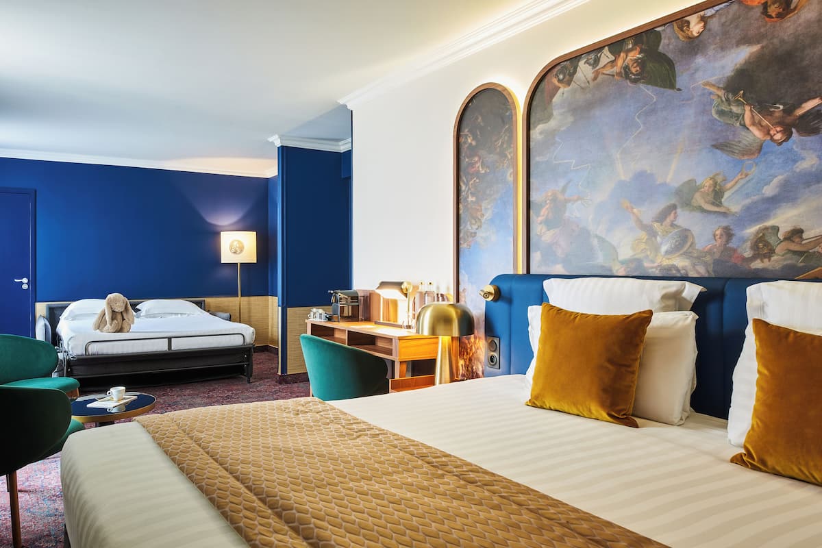 Family Room | Premium bedding, in-room safe, desk, iron/ironing board