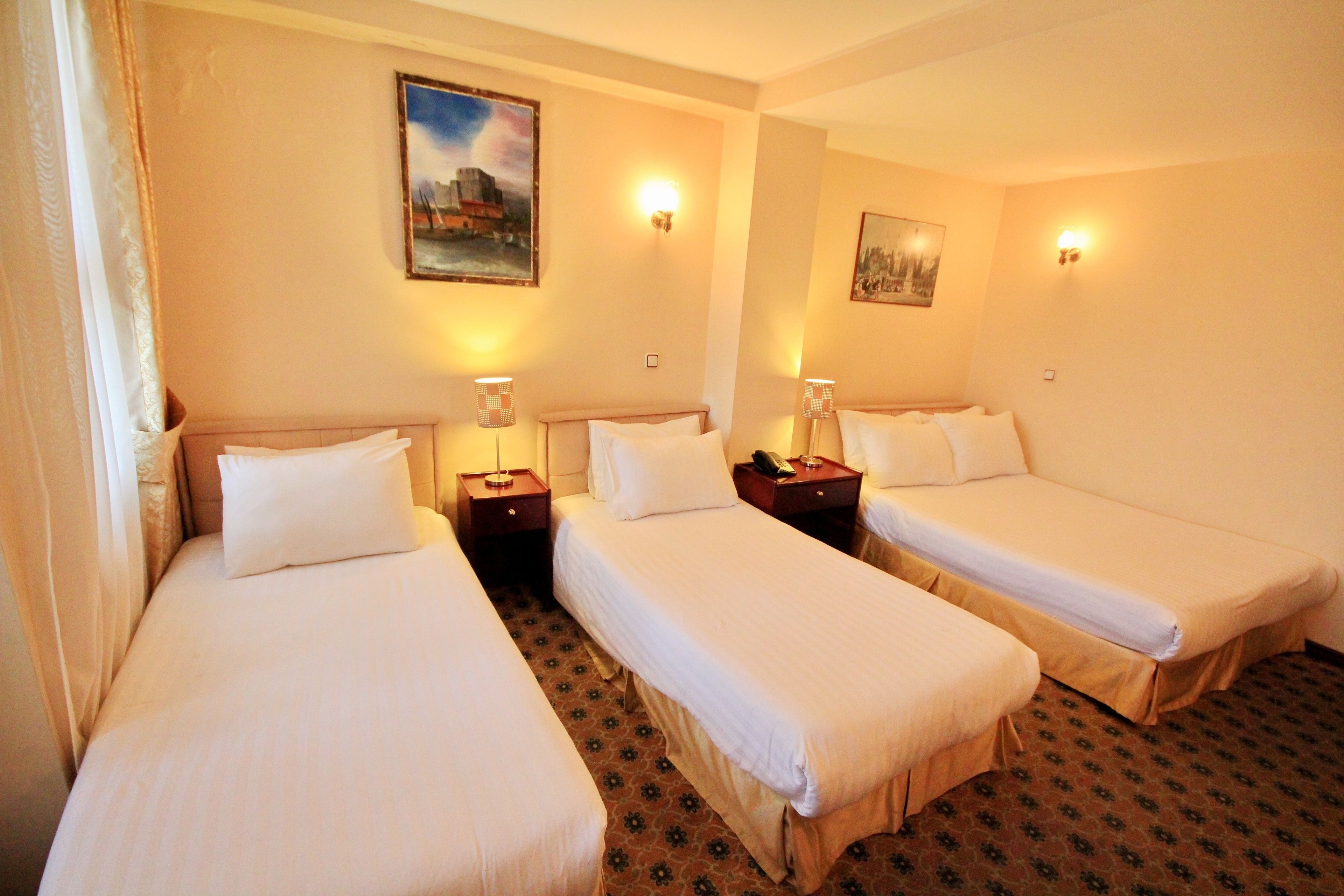 family room | premium bedding, minibar, in-room safe, individually decorated