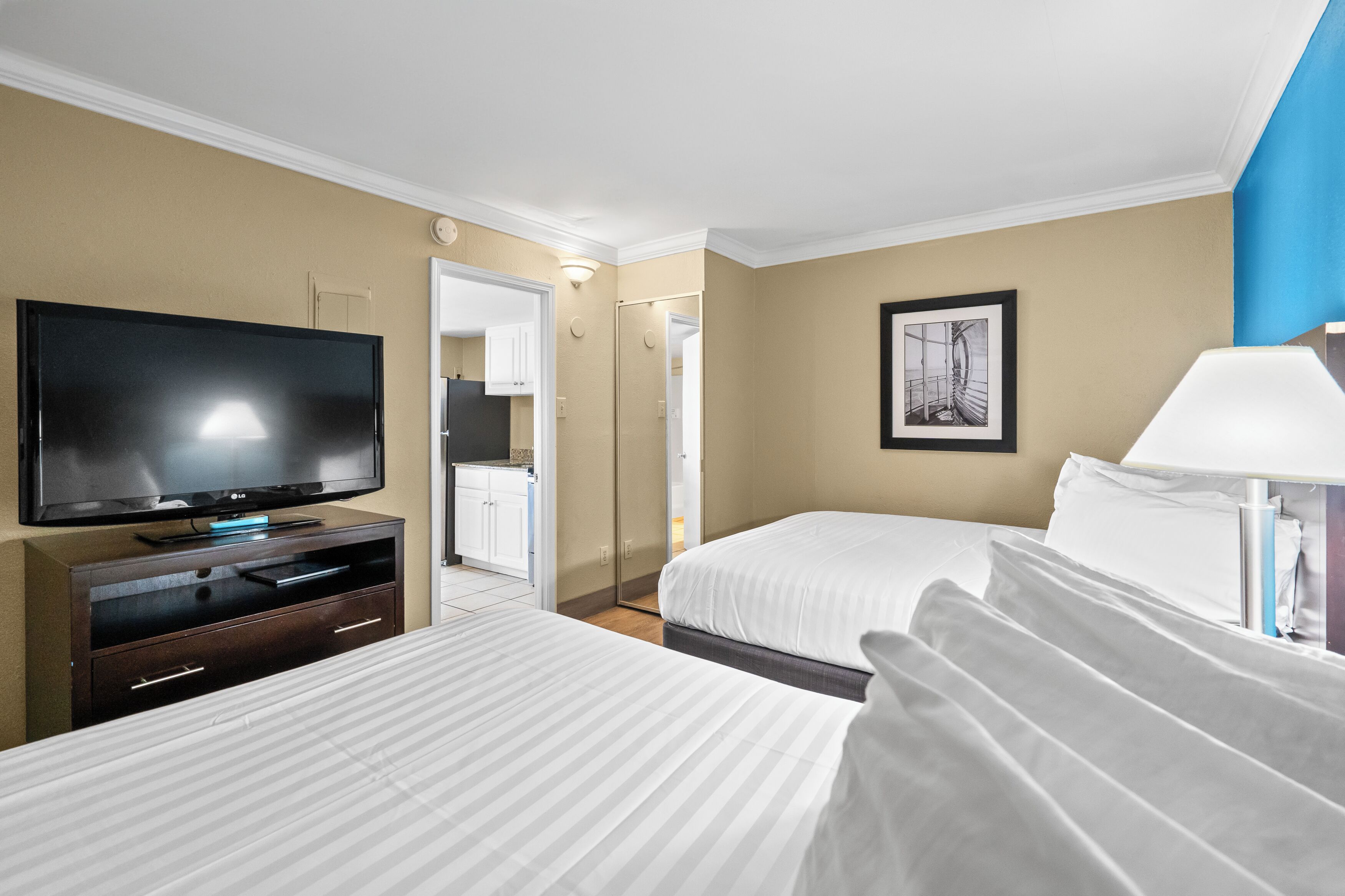 3 queen beds, pool view (efficiency), non-smoking | desk, laptop workspace, iron/ironing board, free wifi