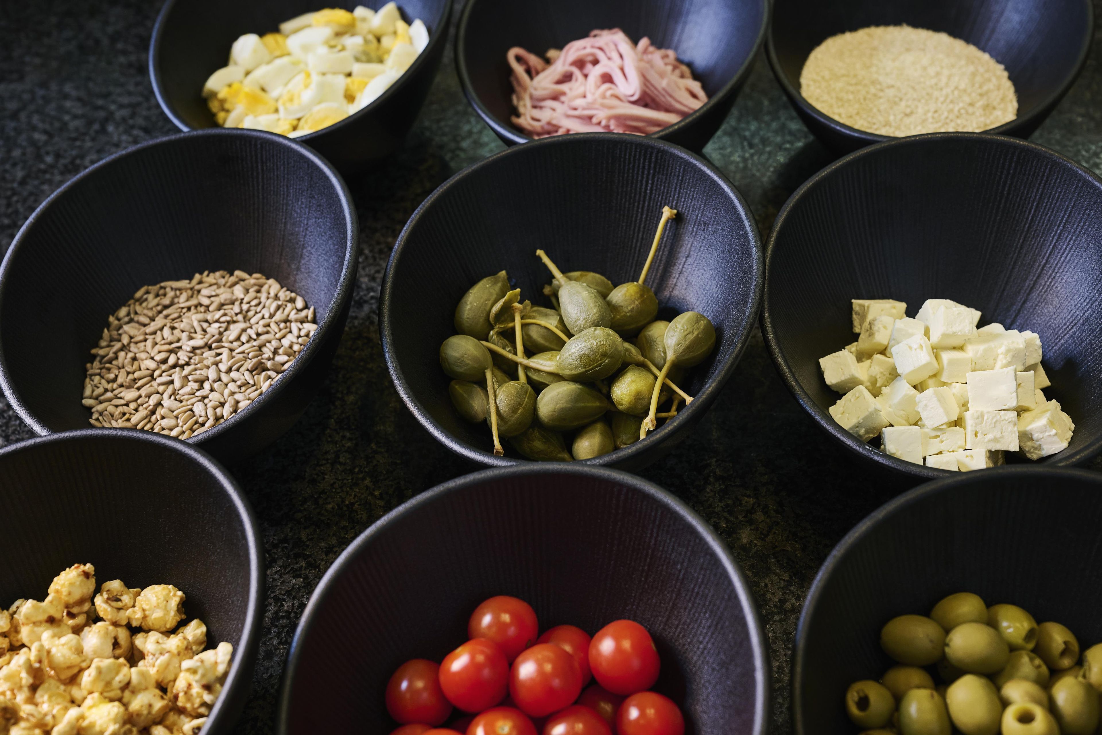 Bowls containing various food items.