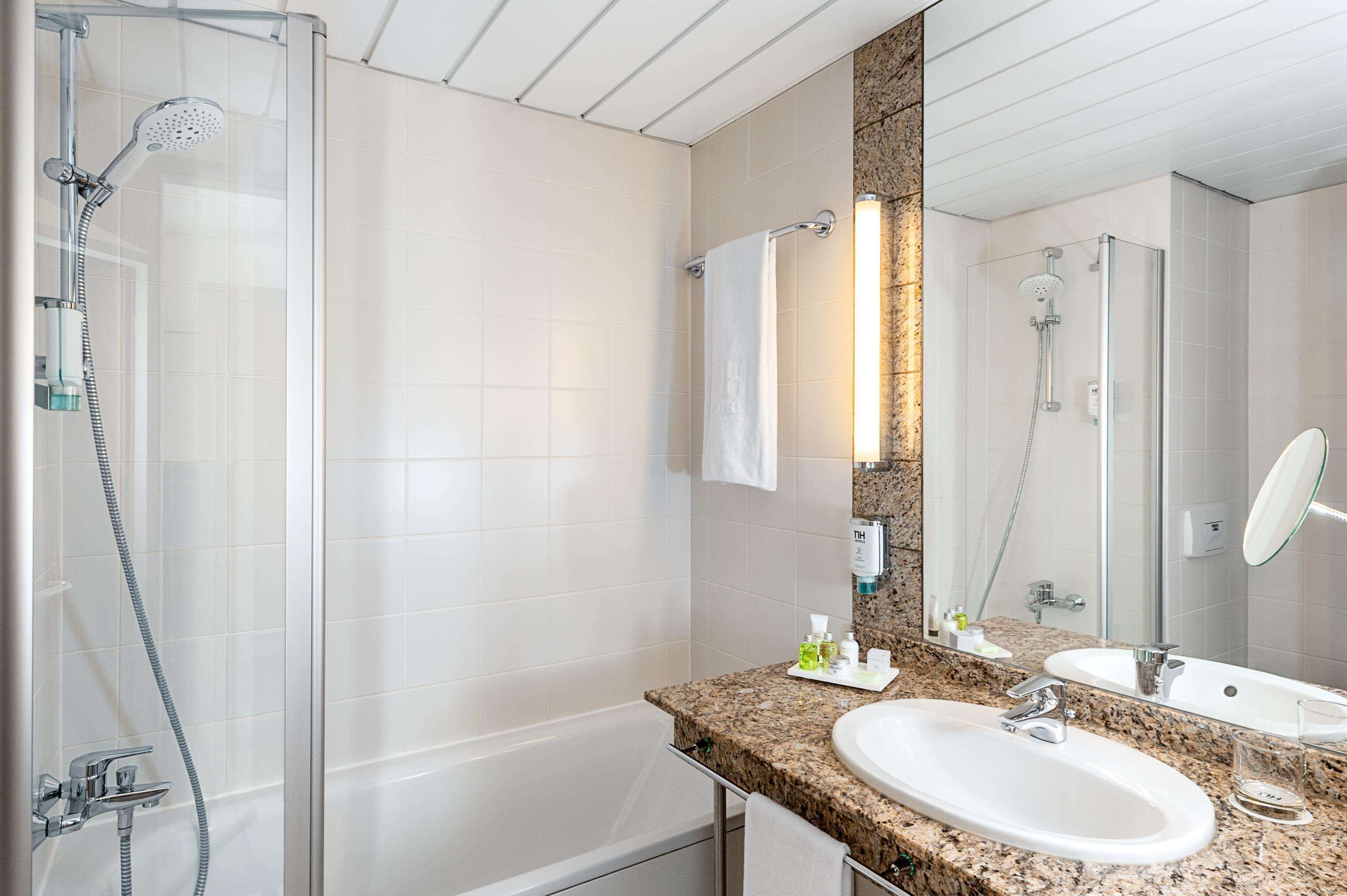 combined shower/bathtub, deep-soaking bathtub, designer toiletries