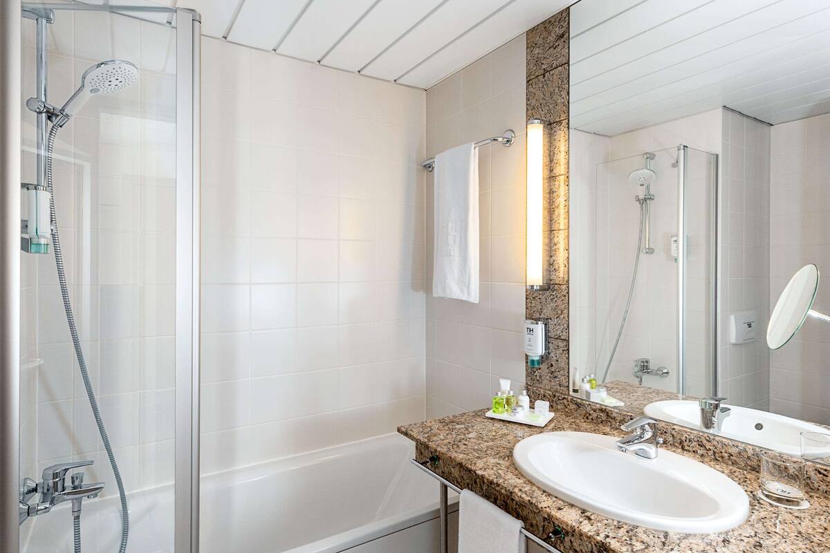 combined shower/bathtub, deep-soaking bathtub, designer toiletries