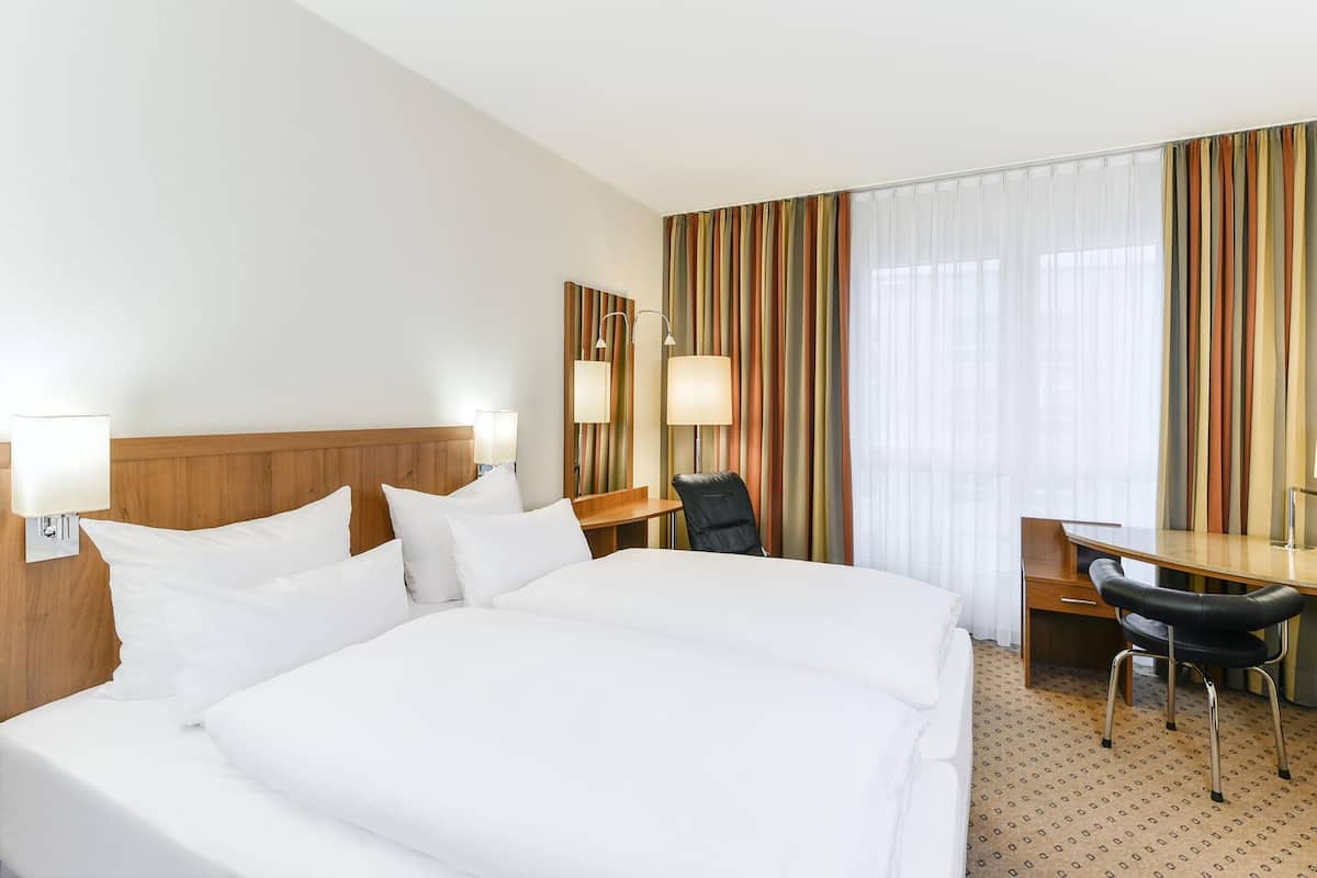 Premium bedding, pillow-top beds, minibar, in-room safe