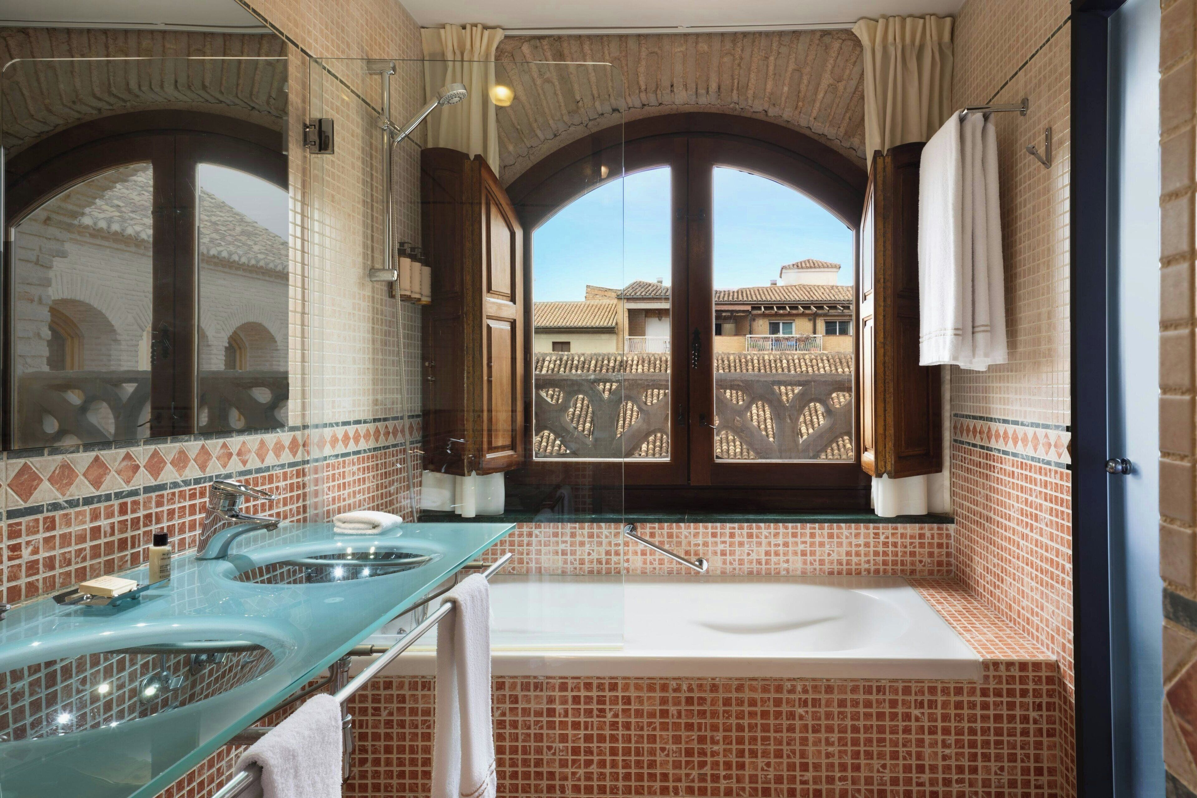 premium room, 1 king bed, non smoking | bathroom | combined shower/bathtub, designer toiletries, hair dryer, bathrobes