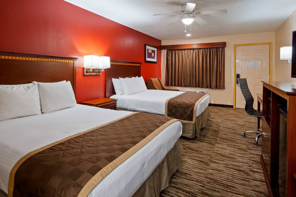 pillow-top beds, desk, laptop workspace, blackout curtains