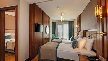 Triple Room | Premium bedding, minibar, in-room safe, individually decorated