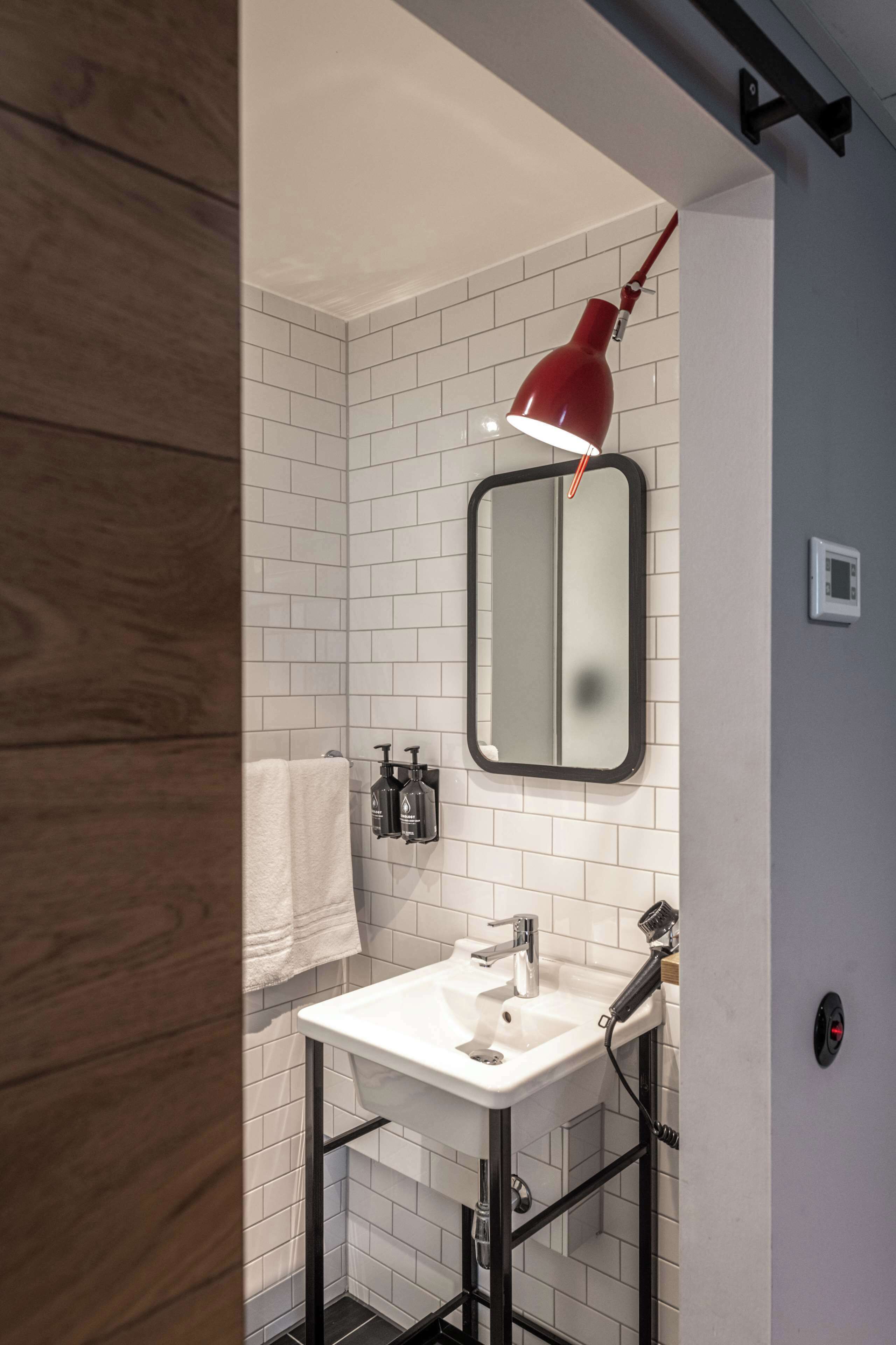 rainfall showerhead, eco-friendly toiletries, hair dryer, towels