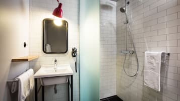 Rainfall showerhead, eco-friendly toiletries, hair dryer, towels