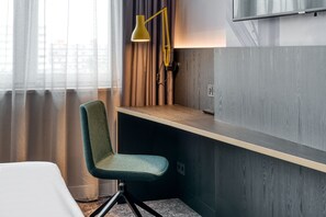 Premium bedding, down duvets, in-room safe, desk