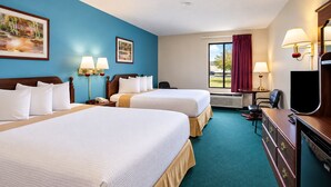 A hotel room with two beds, a desk, a television, and a window with curtains. - Days Inn by Wyndham Battlefield Rd/Hwy 65 (Springfield)