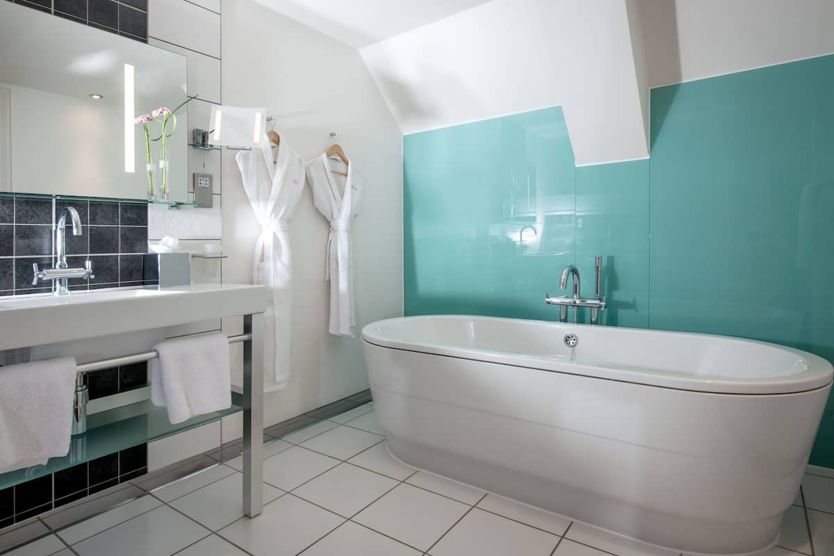 most enviable double room | bathroom | combined shower/bathtub, designer toiletries, hair dryer, towels