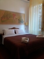 Standard Double Room | Minibar, in-room safe, desk, free cribs/infant beds